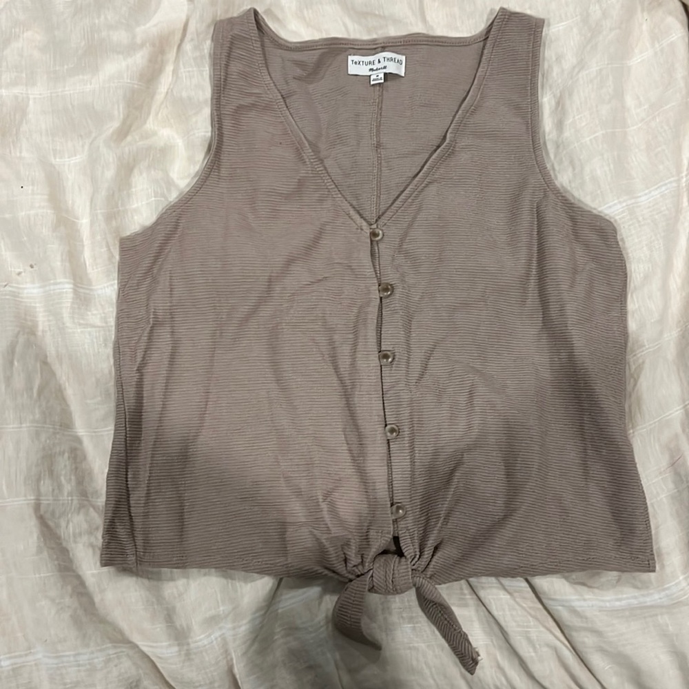 Adorable madewell tank top that has a tie at the bottom.Never worn before!